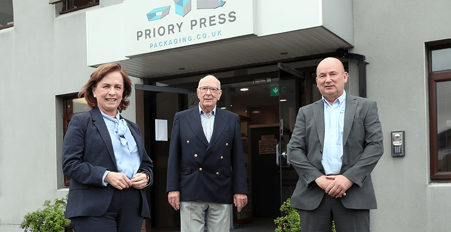 Pictured with Diane Dodds at Priory Press Packaging in Conlig are (centre) Ernest McConville, Chairman, Priory Press Packaging, and Mark McConville, Managing Director of the company.