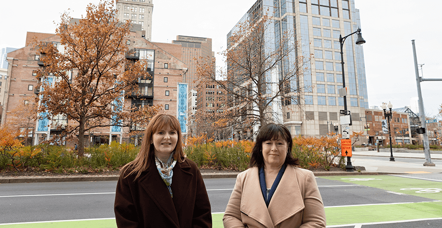 Minister for the Economy, Dr Caoimhe Archibald and Andrea Haughian, Head of Americas at Invest NI are standing on a street in Boston