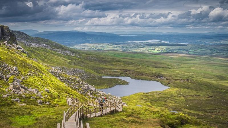 Cuilcagh Mountain Park - View on lake and valley below with dramatic sky, Northern Ireland