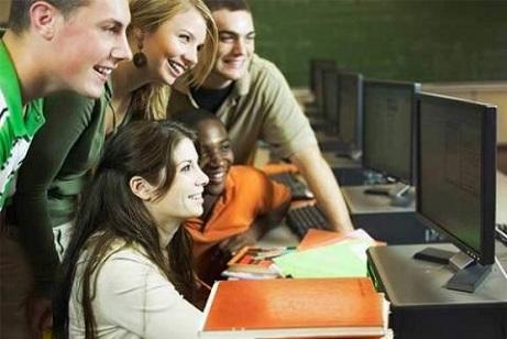 Students around a computer screen